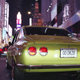 A Mazda RX-2 waits in Time Square traffic as part of the 7s Day run in 2018.